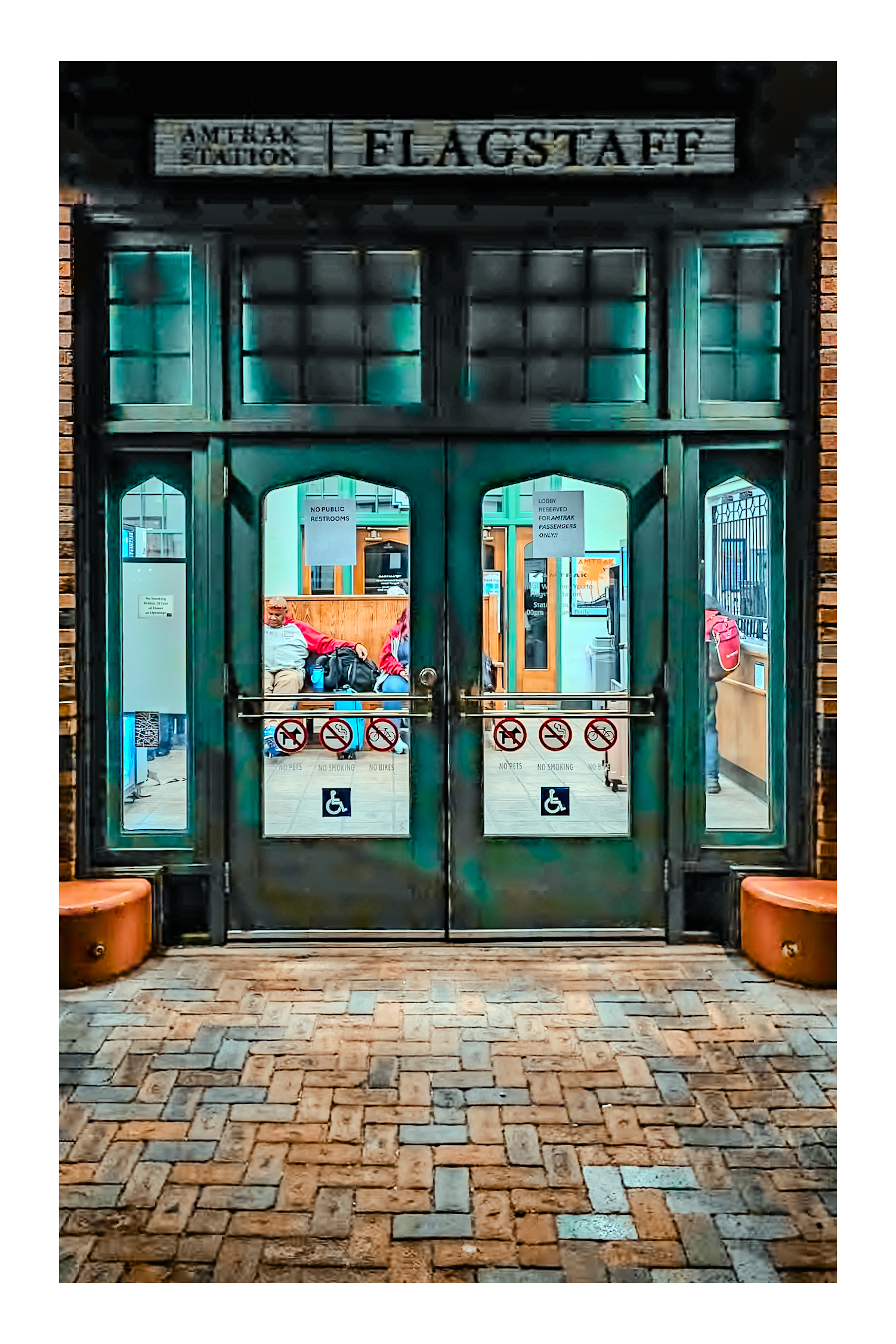 Flagstaff Amtrak Station entrance — patinated teal doors, historic depot
